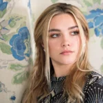 Florence Pugh posing on red carpet during film promotion event
