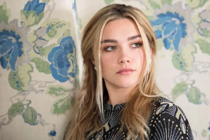 Florence Pugh posing on red carpet during film promotion event