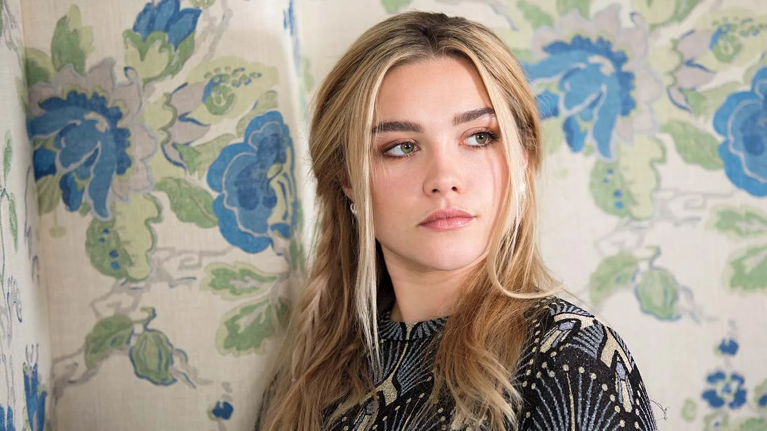 Florence Pugh posing on red carpet during film promotion event